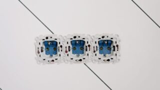 Power sockets with various connectors and bolts on wall in room at home
