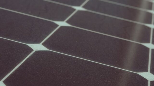 Detailed view of solar panel cells for alternative energy generation and innovation in technology.