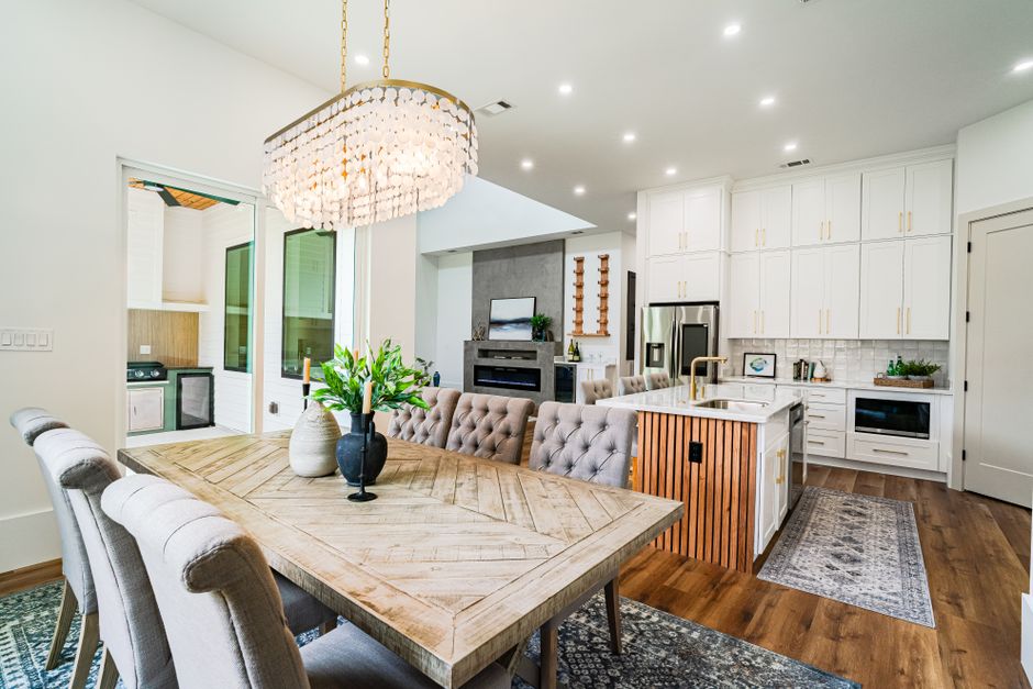 Spacious and stylish kitchen and dining area in a modern New Orleans home.