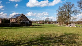 Scenic rural landscape with solar-powered house in Coesfeld, Germany.