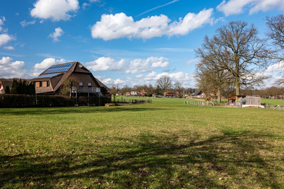 Scenic rural landscape with solar-powered house in Coesfeld, Germany.