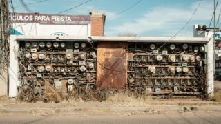 Abandoned rusty electrical panel with wires in Mexico street.