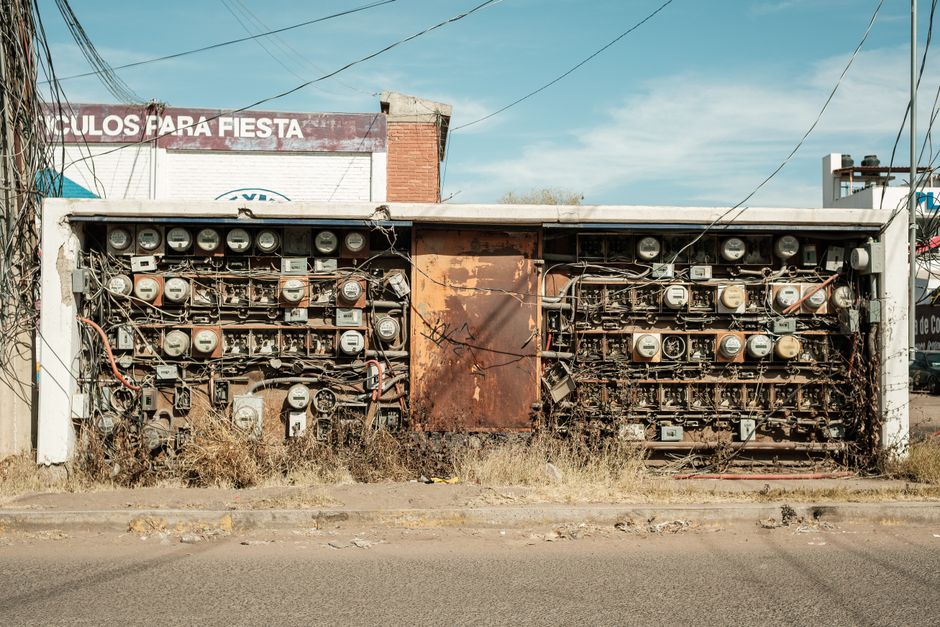 Abandoned rusty electrical panel with wires in Mexico street.