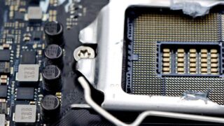 Detailed close-up image of a CPU socket and components on a motherboard.
