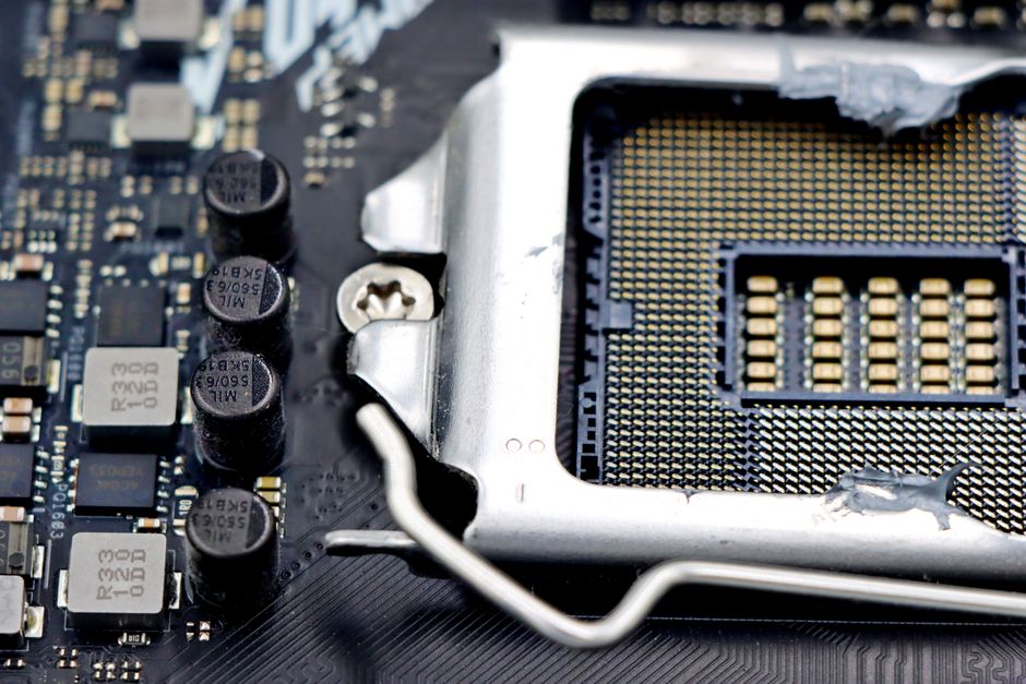 Detailed close-up image of a CPU socket and components on a motherboard.