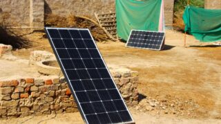 Outdoor solar panels in a rural setting, showcasing renewable energy solutions.