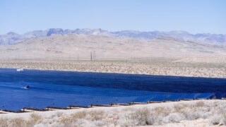 Stunning view of a large solar farm harnessing energy in a vast desert landscape.