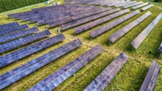 Aerial perspective of a solar farm in Kellogg, Minnesota, showcasing renewable energy technology.