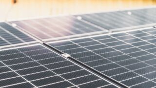 Detailed view of a rooftop solar panel array capturing sunlight for renewable energy production.