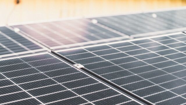 Detailed view of a rooftop solar panel array capturing sunlight for renewable energy production.