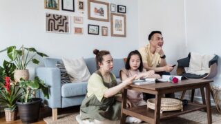 A family enjoying quality time at home in a cozy and stylish living room setting.