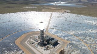 Expansive solar power plant in the California desert, showcasing renewable energy technology.