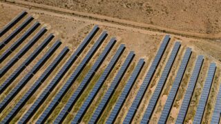 Aerial shot of solar panels in De Aar, illustrating sustainable energy in South Africa.