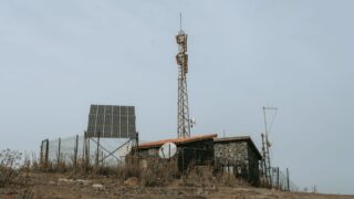 Rural remote station featuring solar panels and communication towers in the Canary Islands, Spain.