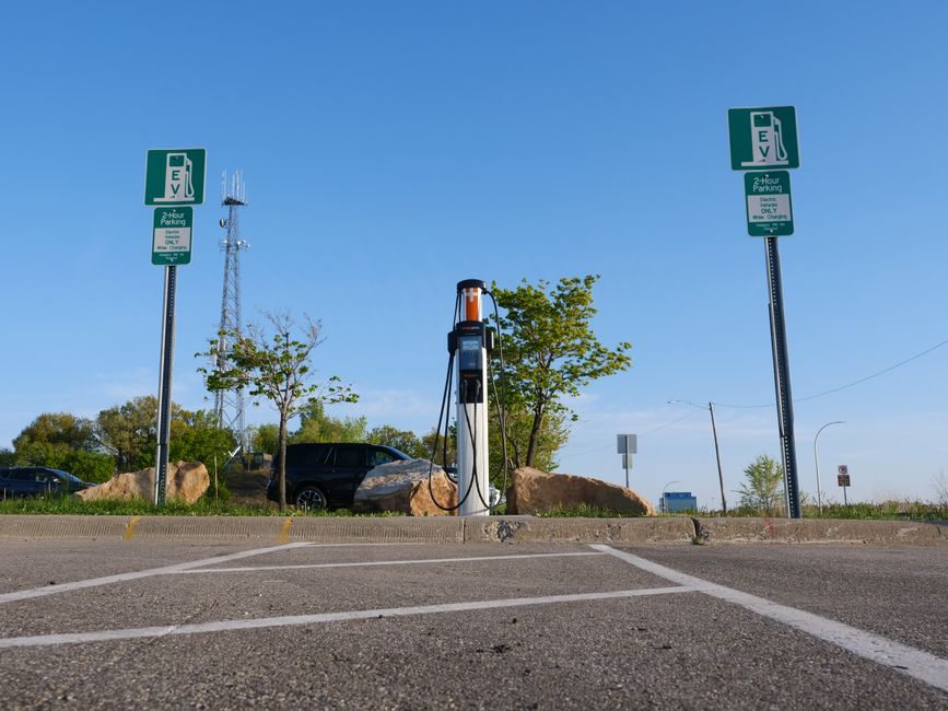 EV charging station in a city location with a focus on clean energy and modern transport.