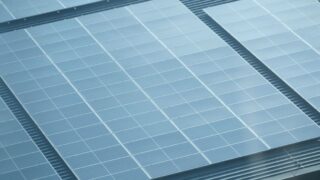 Detailed view of solar panels installed on a rooftop, showcasing green energy.