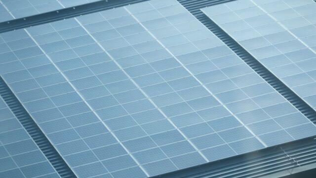 Detailed view of solar panels installed on a rooftop, showcasing green energy.