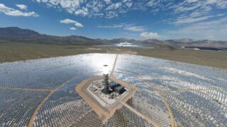Aerial view of solar farm in Wheaton Springs, CA with vibrant sky and desert landscape.