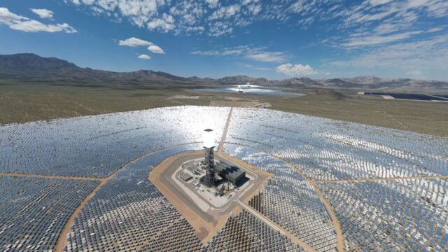 Aerial view of solar farm in Wheaton Springs, CA with vibrant sky and desert landscape.