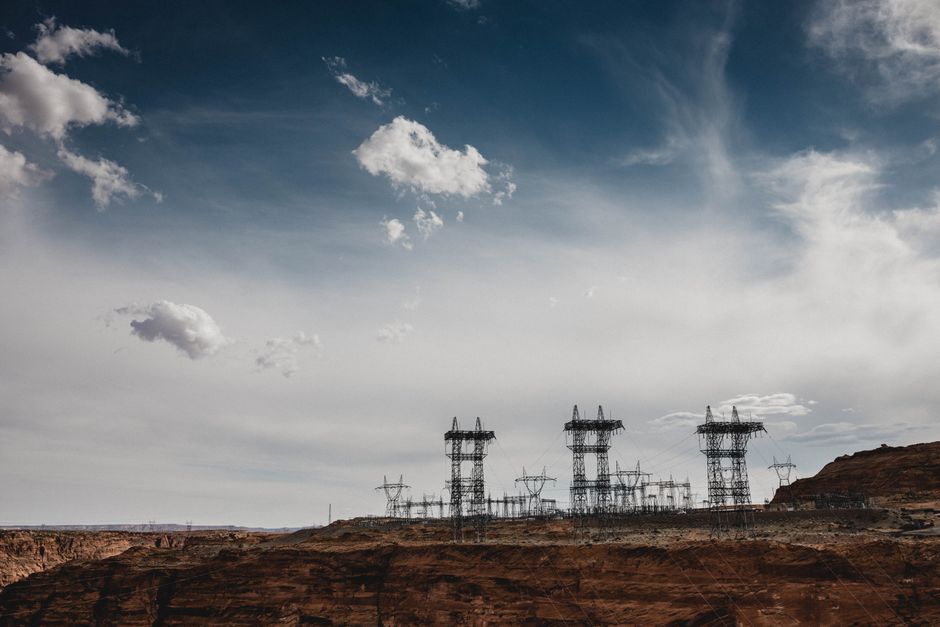 High-voltage power lines stretch across the desert landscape at North Rim, Arizona