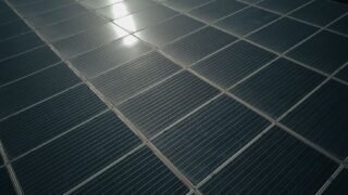 Captivating close-up of solar panels reflecting sunlight, showcasing renewable energy technology.