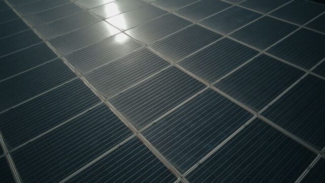Captivating close-up of solar panels reflecting sunlight, showcasing renewable energy technology.